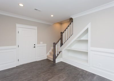built-in under stairs shelves